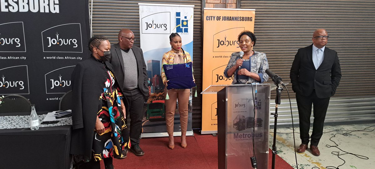 CityofJoburgZA's tweet photo. It's time for the official cutting of the ribbon and the unveiling of the newly refurbished Joburg Metrobuses 👏🏾 #JoburgMetrobus #SaferJoburg ^GZ https://t.co/qHoP5Tq4UY