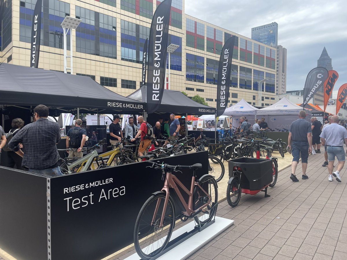 hayes_henry's tweet photo. The Riese &amp; Müller Test Area at #Eurobike2022 … Ben and Felix, head of R&amp;D, are off for a test-ride currently on the UBN and on #YouTubeLive so check it out! https://t.co/7SDHK5BTim