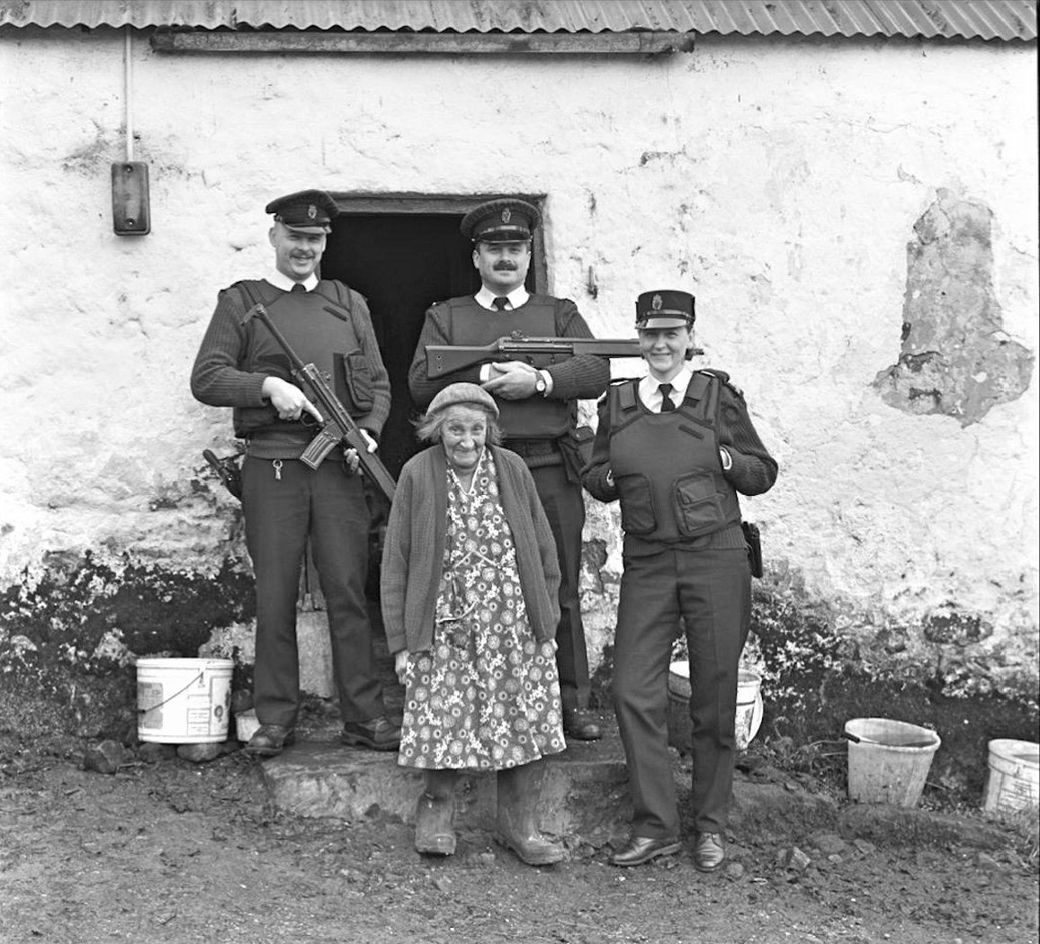 RUC officers from Clogher station with Sarah Primrose who lived on a farm off the beaten path in Mullaghfad, Co Tyrone. These officers kept an eye on her welfare especially in the winter. c2000. (courtesy of Bobbie Hanvey). facebook.com/Northern-Irela…