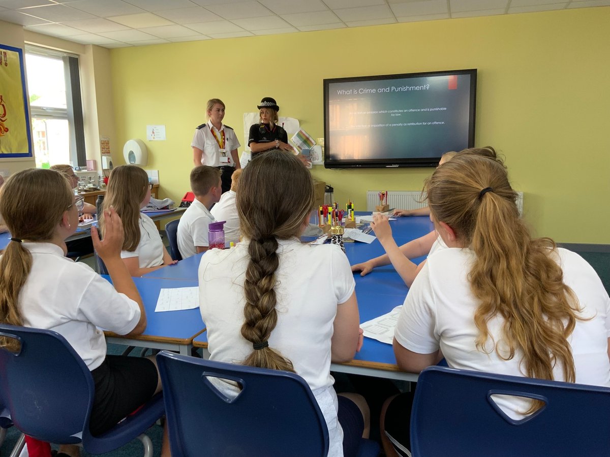 EStaffsPolice's tweet photo. PC James from our neighbourhood policing team and Prison officer Baker from HMP Dovegate attended Holy Trinity primary school Burton. They gave a talk on crime and punishment and making the right choices. #CommunityEngagement #BurtonNPT #HMPDovegate https://t.co/xZZDX3tpR5
