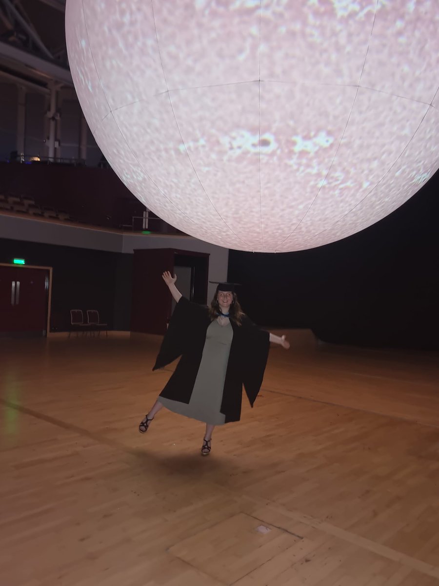 RoyalAstroSoc's tweet photo. Our Communications Assistant @cait_cullen celebrated her graduation yesterday (between working on press releases and waiting for JWST images!) - here we are with the SUN exhibition at @warwickarts.

Congratulations Cait, and everyone else graduating this week! 👏🎓💫 https://t.co/rsEvPPRLIY