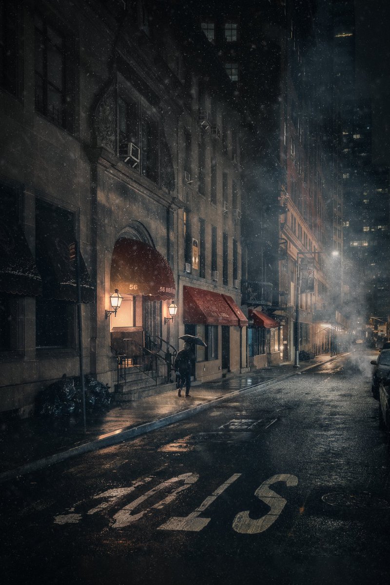 mindzeye's tweet photo. “The Dark Night” A photo I captured on a snowy evening in New York City. I can still hear the steam piping through the sewer grates into the cold wintry air and the slow tap of footsteps from the lone stranger walking off into the night. I often wonder where he was headed. https://t.co/Jpxh8P06pd