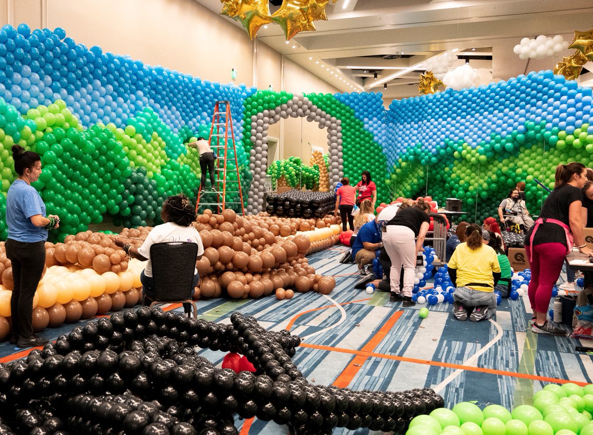 GKTWVillage's tweet photo. It takes a village to create the Village from 500,000 balloons! 300 balloon artists from 22 countries are collaborating to produce #BalloonWonderland at the @HRGrandCypress July 15-16 during a 15,000-hour build! https://t.co/kRfWS35Yfc https://t.co/UXNSWOkqBi