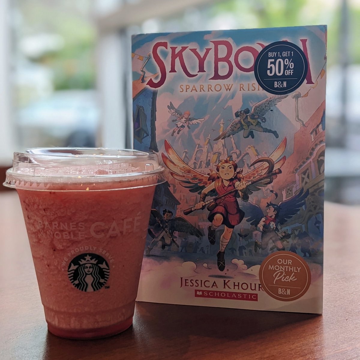 BNBridgeport's tweet photo. Does your young readers love exciting new fantasy worlds? Our #YoungReader #BookoftheMonth, Skyborn: Sparrow Rising by Jessica Khoury, will be a new obsession for Wings of Fire fans! Enjoy it with a Blended Strawberry Lemonade.
#bncafe #SipAndRead #book @jkbibliophile https://t.co/Ar4MMAEWGJ