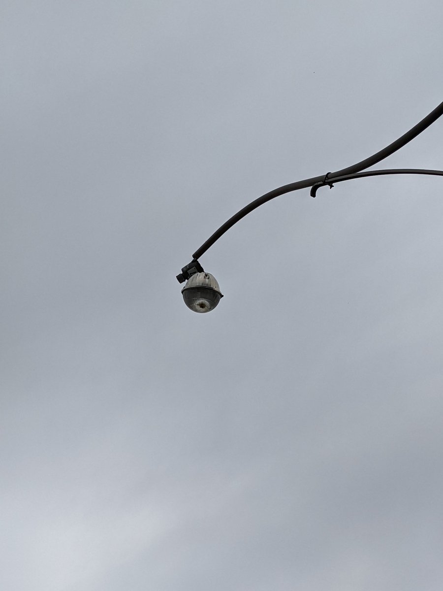 RobertWalterJ's tweet photo. @311Toronto street light detached and hanging by a cable. 1st lamp north of Dupont Street on the east side of Symington Avenue. https://t.co/ltqTMw2Drg