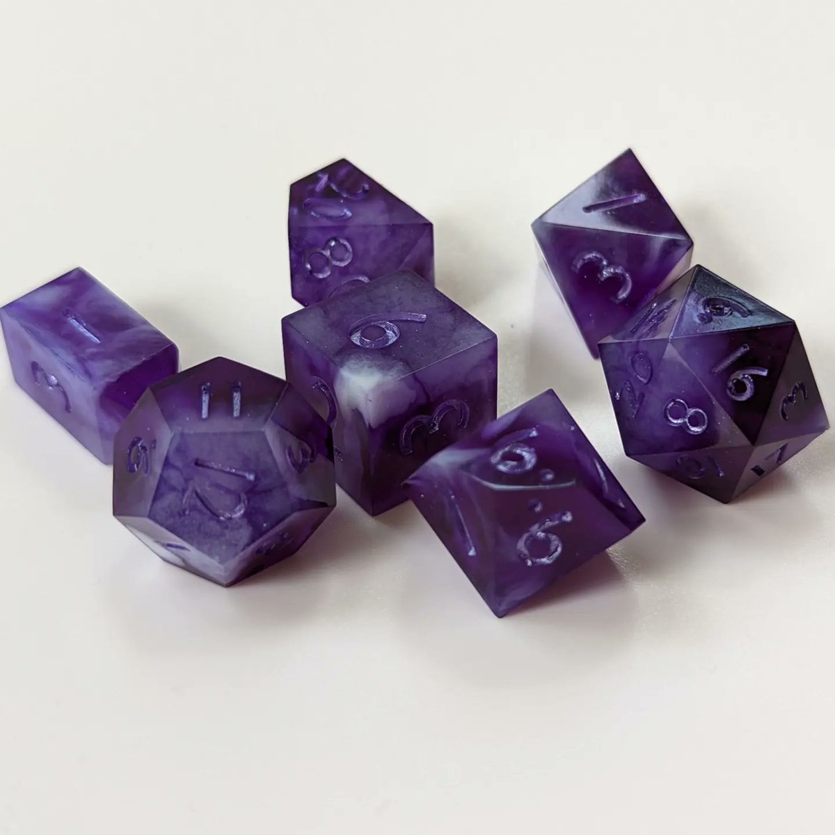 mythscapades's tweet photo. One of my sweetest and most genuine PCs' favorite color was purple, so these make me think of her. 💜💜

#handmadedice #DnD #ttrpg https://t.co/5QKSUsQPfv