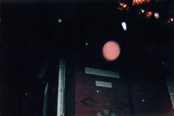 HauntFootsteps's tweet photo. In this photo from one of our #hauntedfootstepsghosttours, a potential, large orange/red #spiritorb flies outside of Rockafellas. Rockafellas is the site of the first church in #Salem, rich with #salemwitchtrials history and more. #ghosts #haunted #paranormal https://t.co/uZirLx3JdX