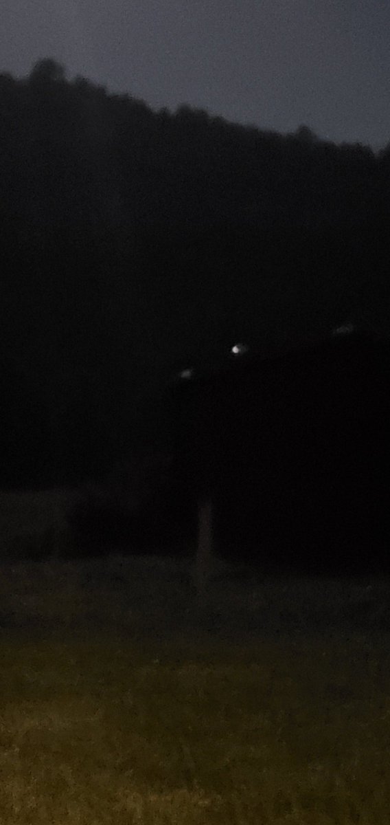 ThatUFOchick's tweet photo. Check out these INSANE pics and tell me what you think.. So, I know it's dark- my brain isn't even wanting to function it's so late! BUT, that's the top edge of our barn with those lights on top. I believe the two flat lighter ones on the outside are reflections of the moon.. https://t.co/ZeBmBUAN6J