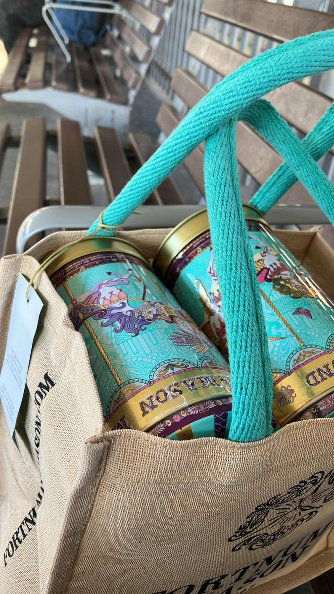 JulieWalkling1's tweet photo. Oooh! My lovely colleague @TriciaKing1 on her way to @amosshe_uk #amosshe22 with prizes for our @JSGroupHE competition. Runner up musical biscuit tins from Fortnum and Mason peeping out of the bag… 🎁 🤩 https://t.co/nWeqyiPHEb