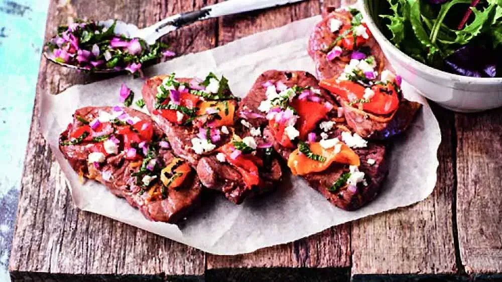 Sun's out this weekend. A quick alfresco dish using BBQ lamb steaks topped with pieces of prepared roasted peppers and finished with a refreshing mint and red onion relish. Recipe here >> bit.ly/2mUMteT #Butcher #Crouchend