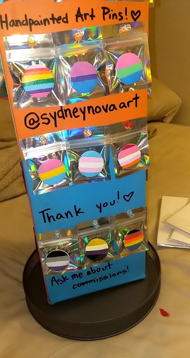 SydneyNovaArt's tweet photo. Some #buttonpins I #handpainted tonight, here we have #originalprideflag #bisexualflag #polyamorousflag #pansexualflag #transgenderflag #lesbianflag #asexualflag #philadelphiaprideflag #nonbinaryflag #lgbtq I myself am poly, bi, and I guess technically pan ❤️ https://t.co/4MZQEfp8Sb