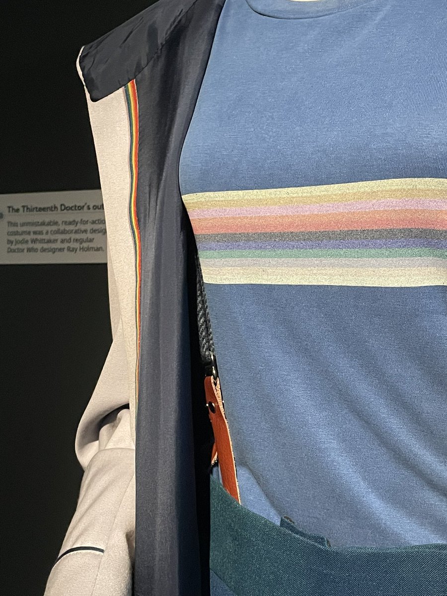 helloobenjamin's tweet photo. really lovely to see the 13th doctor costume at worlds of wonder today! it was a bit of an emotional moment for me lol. it was really interesting to see the flux navy braces paired with this tshirt!! i love it so much <3 https://t.co/74fk5vTLGX