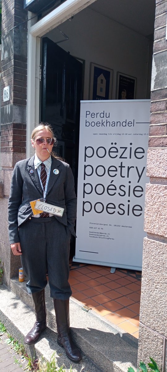 Librarian's tweet photo. Amsterdam! We've travelled round the corner from @sharpamsterdam (obvs. as we're a travelling library!) & are currently having a delightful cigarette break, but will be open @stichtingperdu in 5mins 😁 #sharp22 #TIPL https://t.co/fZDuKltJ6f