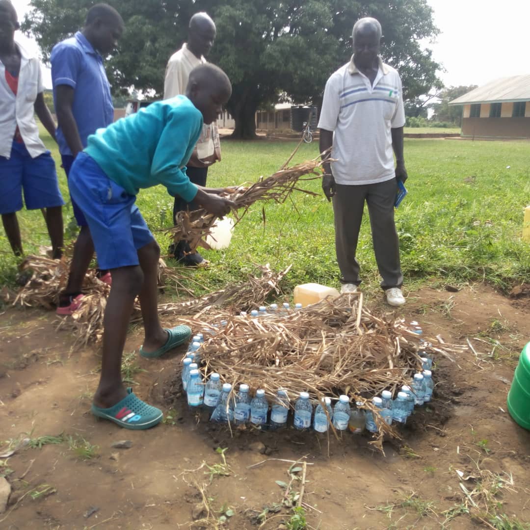 slowfooduganda's tweet image. Kyere Primary School Young Farmers Club members in Serere district learnt how to make gardens using plastic bottles. These were filled with water, tiny holes created at the bottom to release water into the soil in small quantities as a method of irrigation during this dry season.