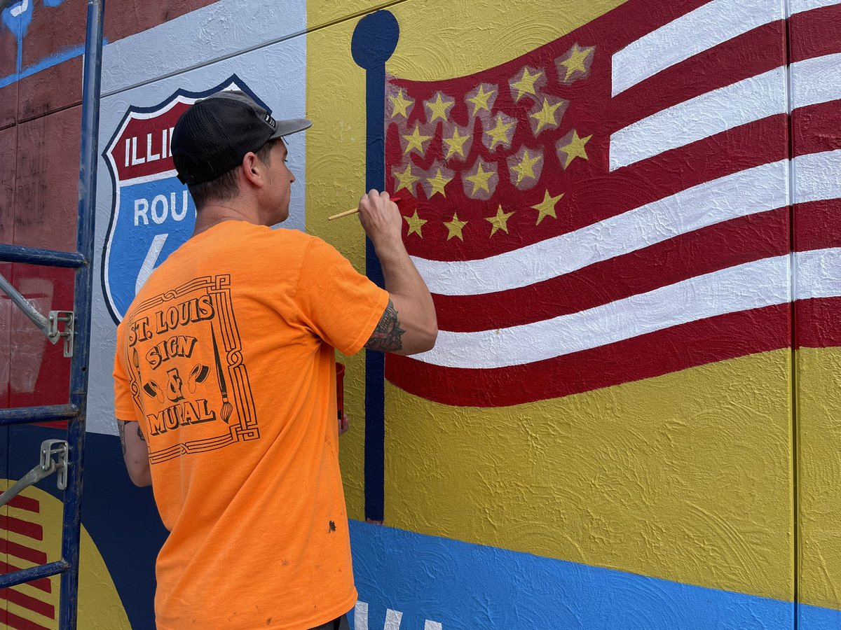 DavidMueth's tweet photo. Route 66 Art Mural Trail Gets Underway. Artist Daniel Ricketts begins work on the Collinsville mural being painted on the side wall of the Bert’s Chuck Wagon building at Center and Main. Murals will be completed in 12 Route 66 communities this summer. https://t.co/fvobO3wnWl