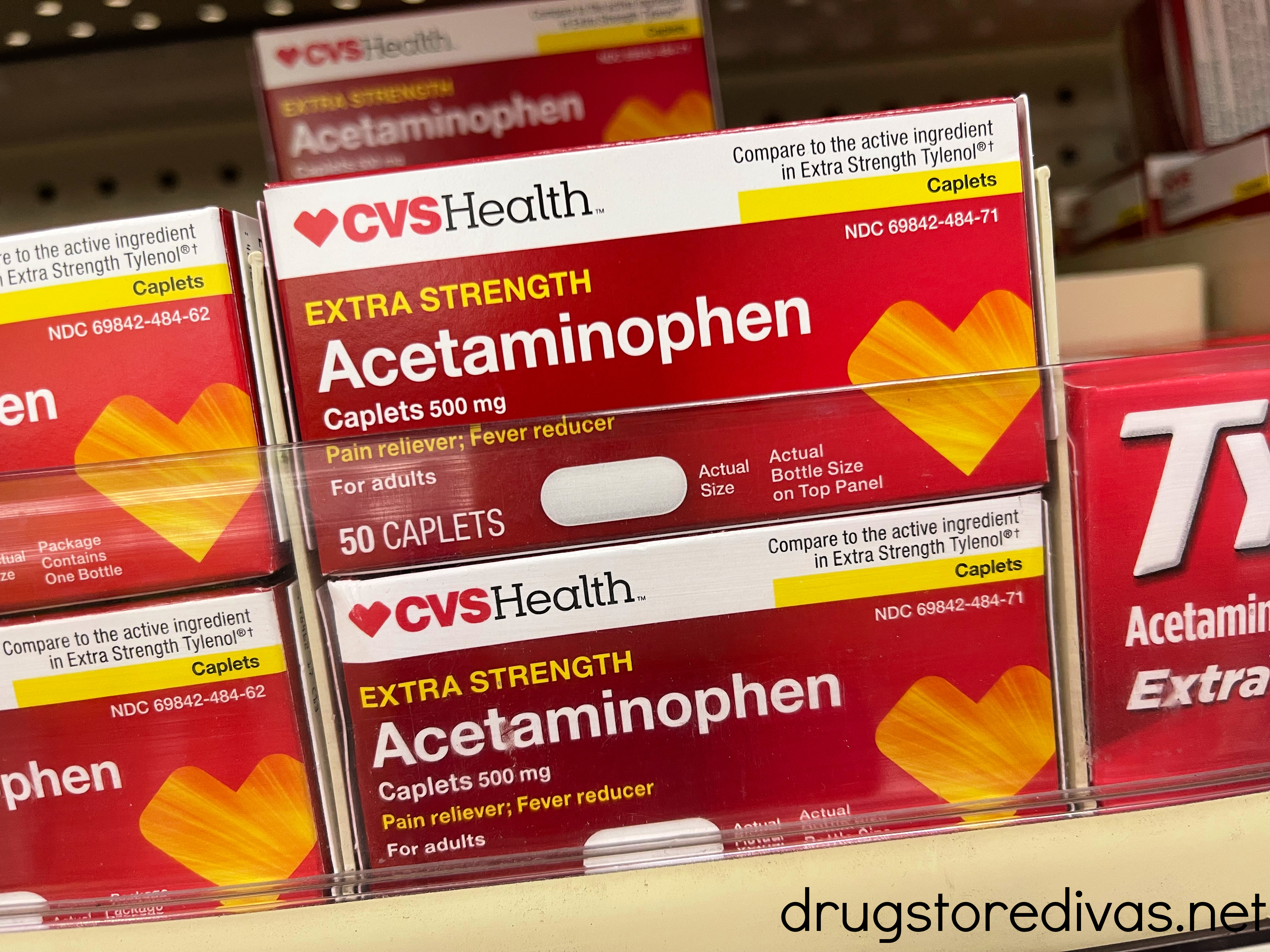 Boxes of acetaminophen on a shelf in a store.