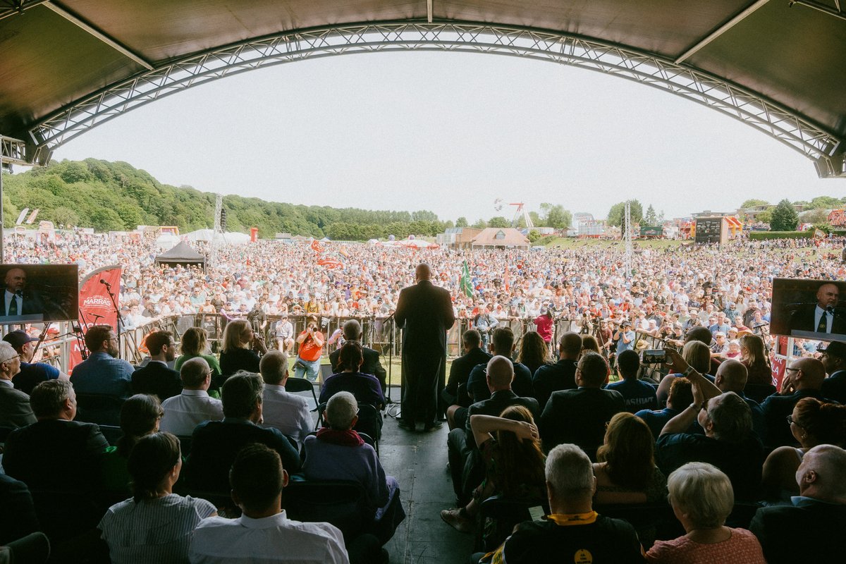 DurhamGala's tweet photo. "We're back. The working class is back. We refuse to be meek, we refuse to be humble and we refuse to be poor anymore." – 

Mick Lynch of the @RMTunion speaking to the huge crowds at the #DurhamMinersGala. Saturday 9 July 2022. https://t.co/wOxk8VVxtL