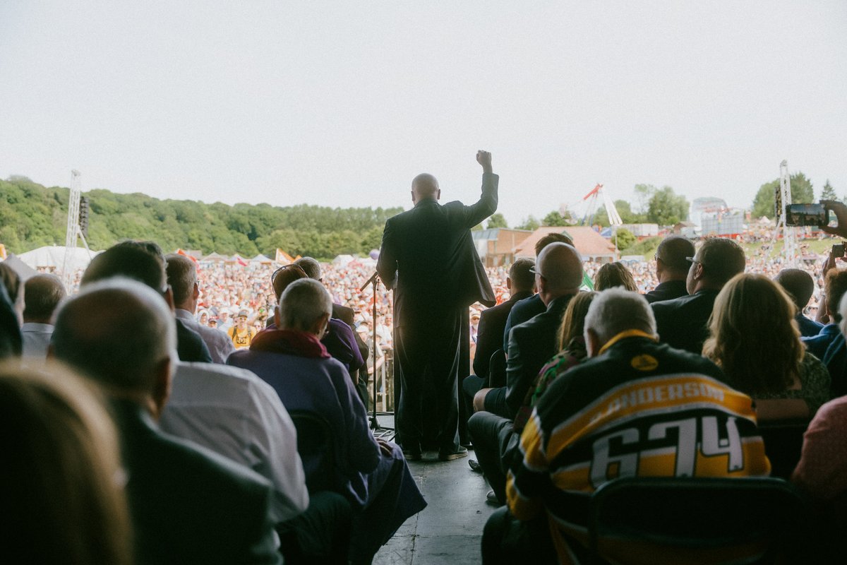 DurhamGala's tweet photo. "We're back. The working class is back. We refuse to be meek, we refuse to be humble and we refuse to be poor anymore." – 

Mick Lynch of the @RMTunion speaking to the huge crowds at the #DurhamMinersGala. Saturday 9 July 2022. https://t.co/wOxk8VVxtL