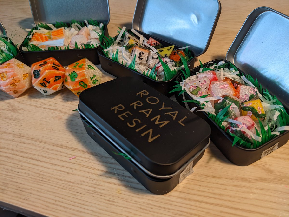 Another little preview of nearly finished sushi dice! Sets come in the tins I embossed and also felted! You can use them to roll your dice if you so please. 
Super excited to send them off to their homes! 

#dice #dicecraft #diceset #dnd #ttrpg #ttrpgdice #polyhedraldice #sushi