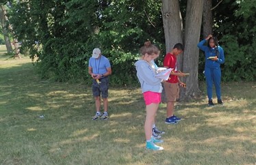 <a href="/UAlbanyASRC/">Atmospheric Sciences Research Center at UAlbany</a> Dave Fitzjarrald and Jeff Freedman are outdoors at ETEC with <a href="/UAlbanySTEP/">UAlbany STEP</a> students analyzing temperature transect along the grass near adjacent trees using hand held temp/RH sensors…