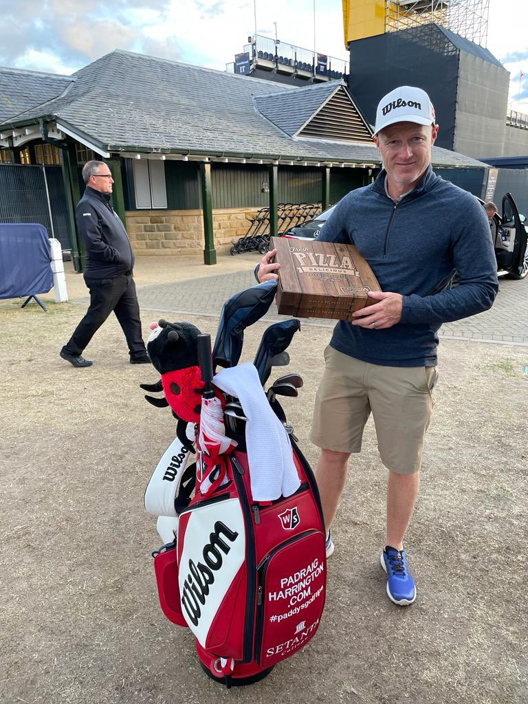 DPWorldTour's tweet photo. Caddie duties never stop @padraig_h 🍕 

#150thopen https://t.co/71pMY2dKQB