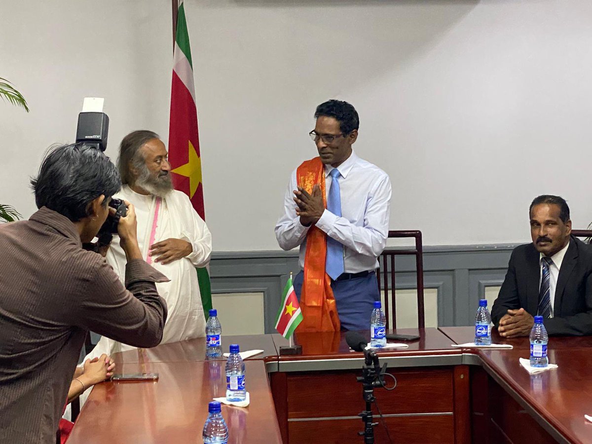 Gurudev's tweet photo. Was welcomed to the Suriname National Assembly by the Deputy Chair, Dew Sharman and parliamentarians of various parties. https://t.co/MnJyUIOYbe