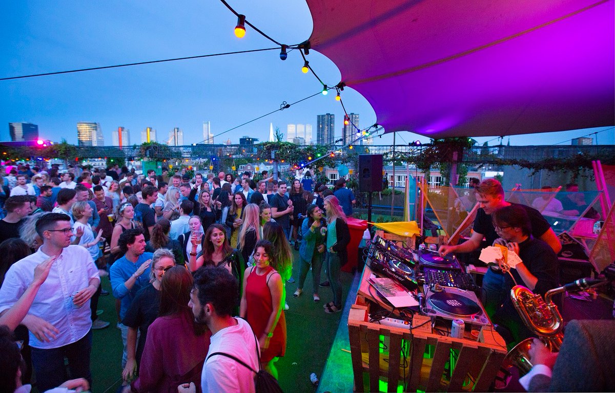 The ultimate chill spot of of Dâk Rotterdam on the roof of the parking garage on Westblaak is back. 🔥 From today till August 13, you can enjoy amazing party's while enjoying the view, sun and the nice people around you. 💚 #rotterdammakeithappen⁠