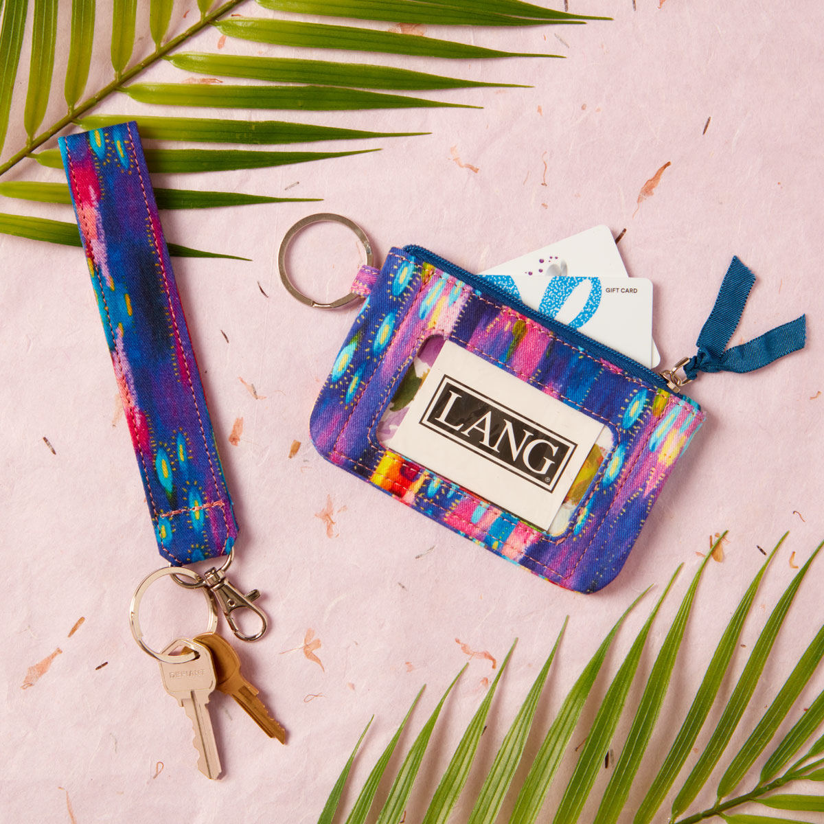 Accessorize in-style with our Artist of the Month, <a href="/EttaVee/">Jessi Raulet</a>!  Her colorful wrist lanyard and ID Holder are perfect for a girl on the go!💜

#langartwork #travel #accessories