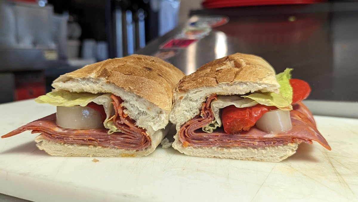 Capo Sando
A homage to a certain deli on Grant: capicola, roasted red pepper, house pepperoncini, sub oil and vinegar, and romaine on a roll

Also available as a half sando with our combos.

#gabagool #capicola #cappo #gooblygook #cafelife #italiansandwich #buffalony #cafegodot