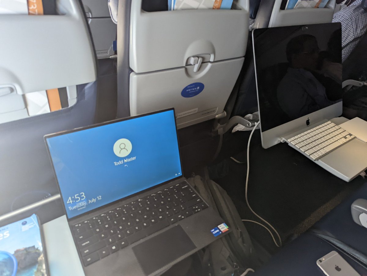 MasterActual's tweet photo. It's a little hard to get the full sense of scale in the original photo, but for comparison, this is my work laptop next to this dude's rig https://t.co/ayzW6AkXim