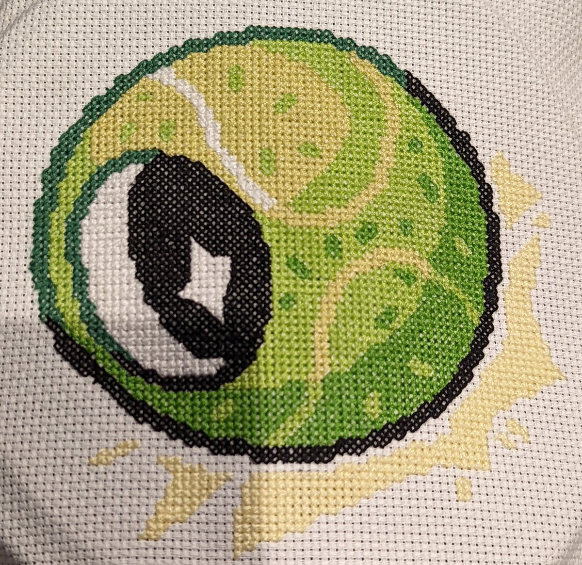 Unicornmon's tweet photo. Cross stitch 2 of 9. Based on @TerryMakesStuff's art. 
I love this little tennis ball. I think he's adorable. https://t.co/olgyl329Rv
