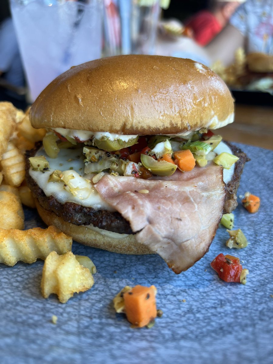 MarioAndersonTV's tweet photo. Gooood afternoon #Twitterverse!
I have this Friday off from work and I’m enjoying #LexBurgerWeek!
This is ‘The Big Easy Burger’
Cajun burger w/provolone, smoked ham, olive relish, lettuce & tomato & remolaude from Harry’s Bar & Grill!
So tasty!
#ShareTheLex🍔 https://t.co/gaERJd8pxi