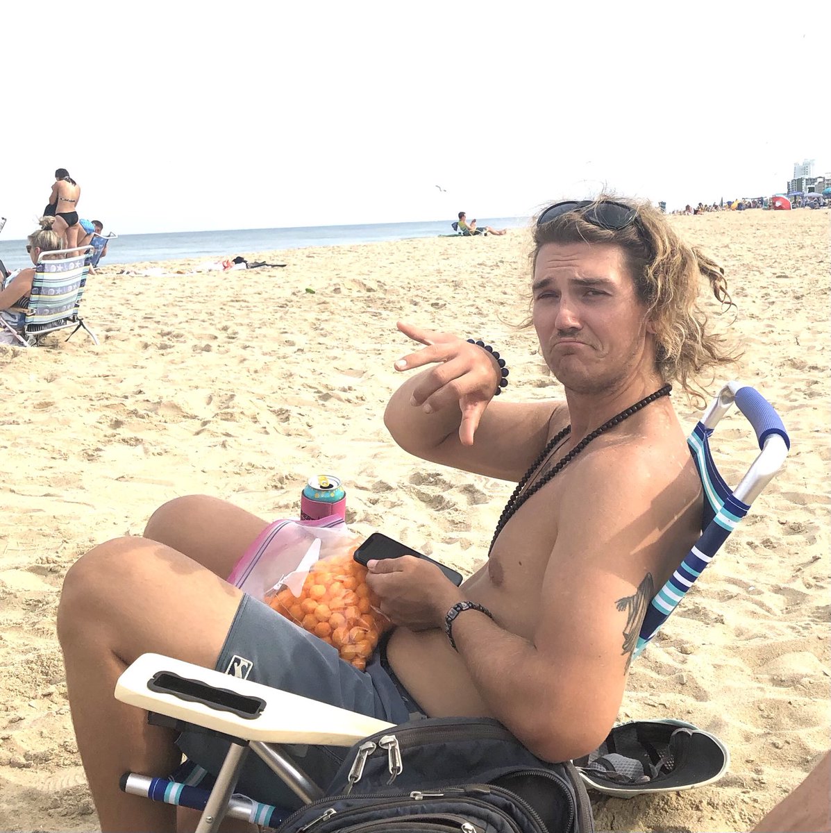 reverserick's tweet photo. How the #beachcrowd eats their @UtzSnacks #cheeseballs #shaka https://t.co/Nq2Df9Y5xt