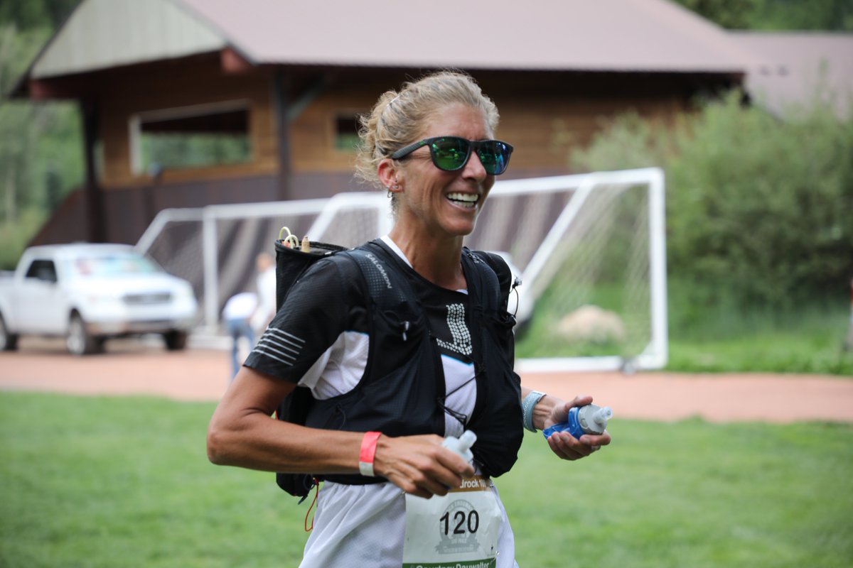 iRunFar's tweet photo. Courtney Dauwalter leads the women to Telluride (mile 27.8) in 6:27 elapsed. Looks composed. Makes quick work before pumping up the aid station on her way out. #HR100 https://t.co/fpTI7O6j9U