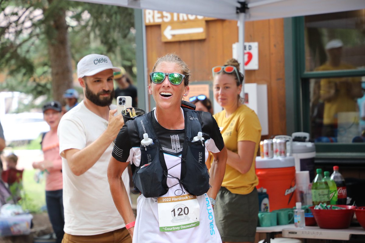 iRunFar's tweet photo. Courtney Dauwalter leads the women to Telluride (mile 27.8) in 6:27 elapsed. Looks composed. Makes quick work before pumping up the aid station on her way out. #HR100 https://t.co/fpTI7O6j9U