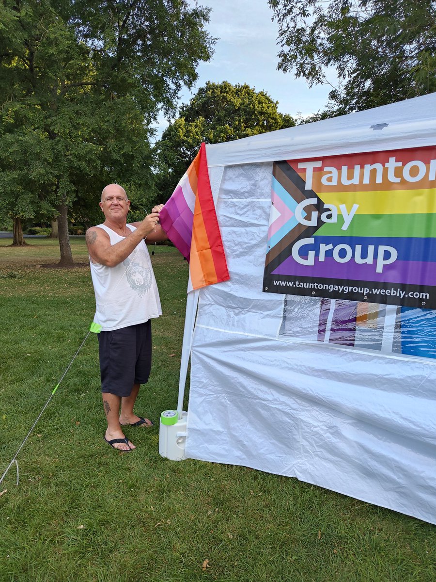TauntonGayGroup's tweet photo. Phew! TGG stall construction and main festooning in Vivary Park done thanks to help from TGG'ers Brad and Ash THANK YOU!! We've gone for a more is more vibe 🫠 finishing touches tomorrow then be ready for @pride_taunton #needadrink https://t.co/yNkPzBYen9