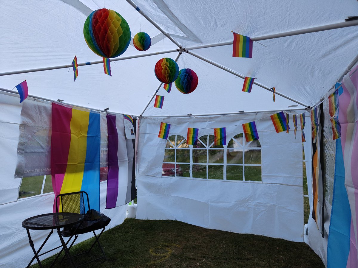 TauntonGayGroup's tweet photo. Phew! TGG stall construction and main festooning in Vivary Park done thanks to help from TGG'ers Brad and Ash THANK YOU!! We've gone for a more is more vibe 🫠 finishing touches tomorrow then be ready for @pride_taunton #needadrink https://t.co/yNkPzBYen9