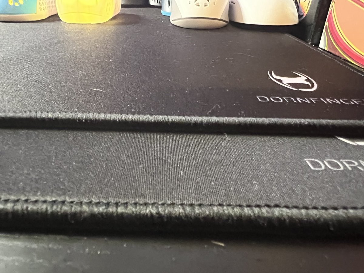 Gen3D_Tech's tweet photo. The Dornfinger Rawpad V2 is the top pad and the V1 is the bottom pad.  The fabric on the V2 looks tighter and darker.  The V2 stitching is tighter also.  The V2 is a faster pad also.  Both pads are 540x540mm each! Will be testing it out this weekend! @Dornfingercom https://t.co/7VPTdUAkZv