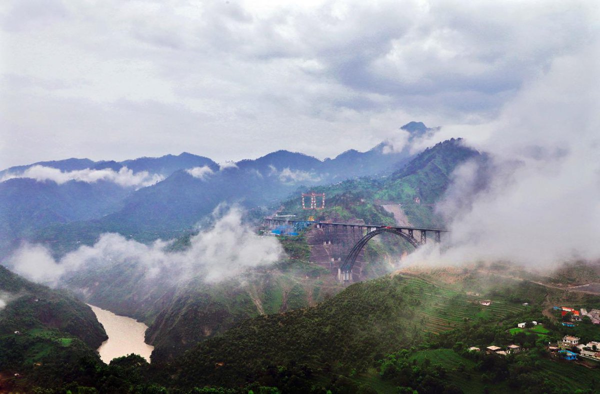 RailMinIndia's tweet photo. An Engineering Marvel, the world’s highest arch bridge surrounded by the heavenly beauty of nature: Chenab Bridge.

Photo Credits: @thetrainstory https://t.co/0uvzKj3DUv