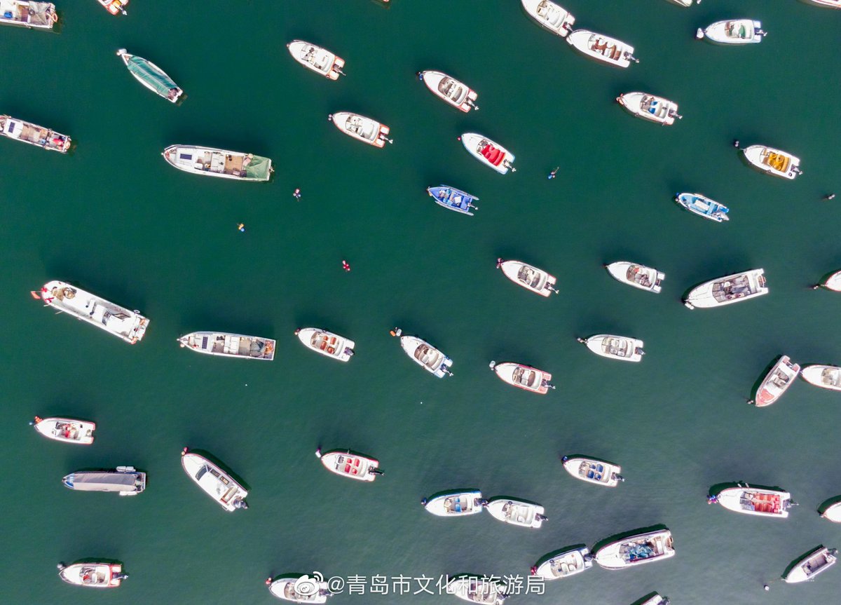 VisitQingdao's tweet photo. The coastal line of Qingdao in summer romantically and elegantly interprets a song of the sea. Sometimes a speedboat rides on the waves to "draw" a wonderful arc, sometimes it sparkles under the sunlight, and sometimes it is calm without a trace of waves.  Liu Dong Photography https://t.co/t7tszNABfO