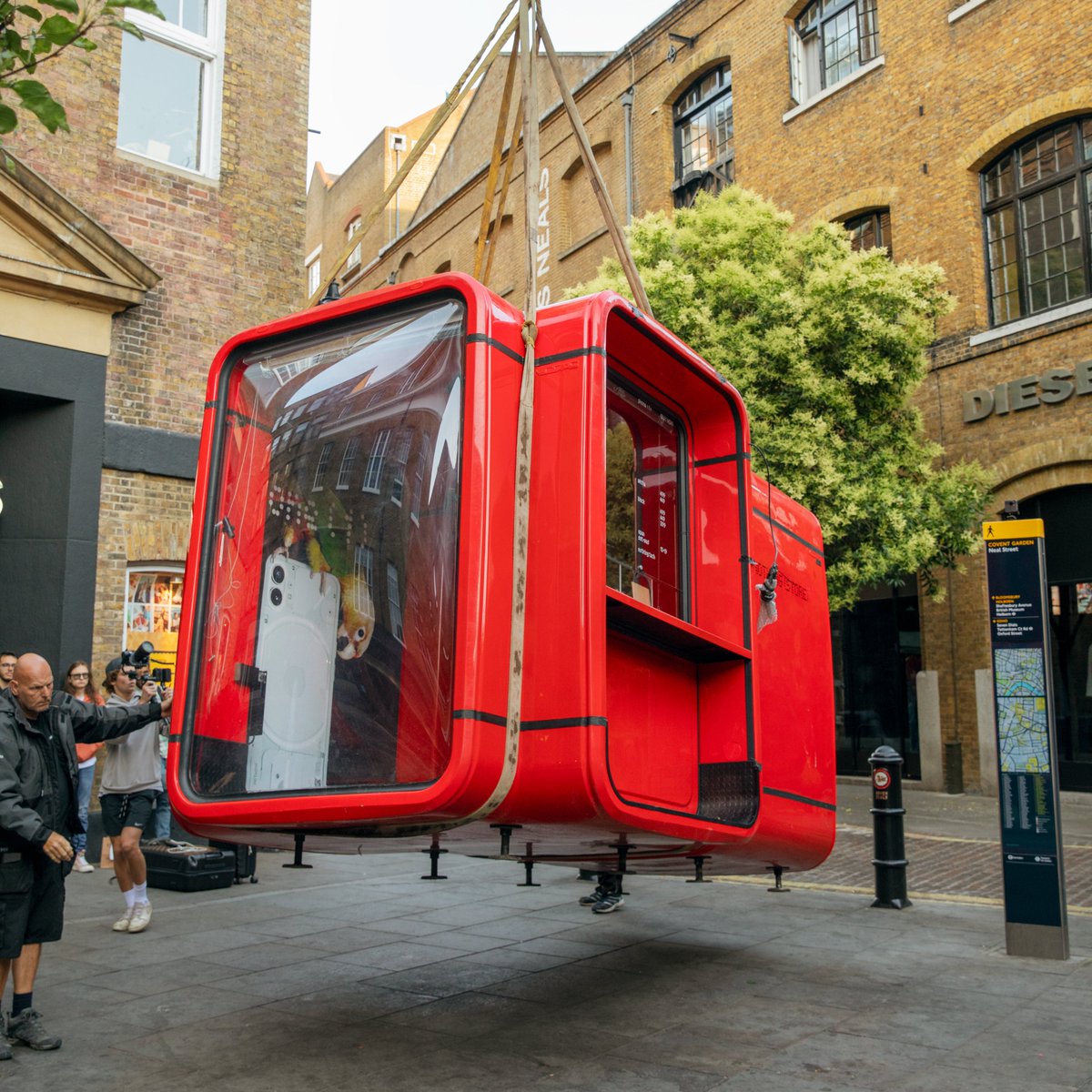 nothing's tweet image. The Nothing Kiosk dropped in London yesterday. Amazing turn out from our community. All here to get their hands on Phone (1).