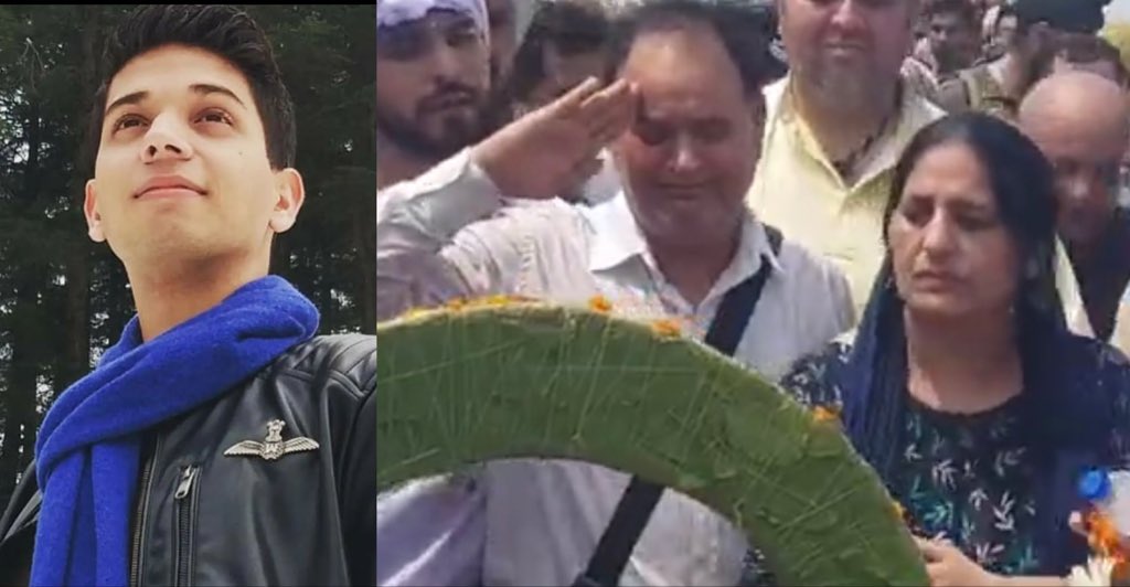 ShivAroor's tweet photo. And just like that, it’s over. 

Flt Lt Advitiya Bal’s parents at his last rites yesterday.

May we never forget. https://t.co/fue6ZsQ21w