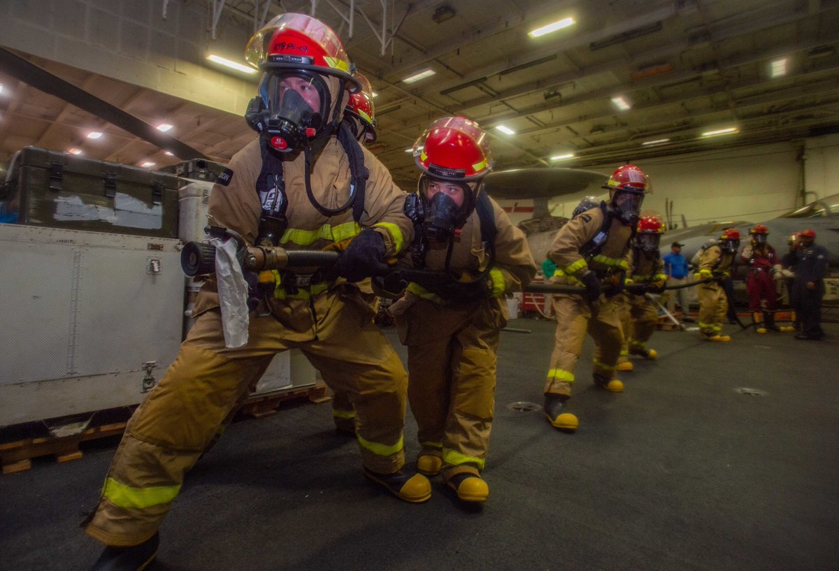 NavalSafetyCmd's tweet photo. 🔥 #FireSafety Friday: Sailors fight a simulated fire during a damage control drill aboard @Gipper_76. 

📸 by MCSN Natasha ChevalierLosada

#USSReagan #CVN76 #USSRonaldReagan #CSG5 #FireDrill #Firefighting #Firefighters #DamageControl #NavalSafety https://t.co/fBfjgeAbNF