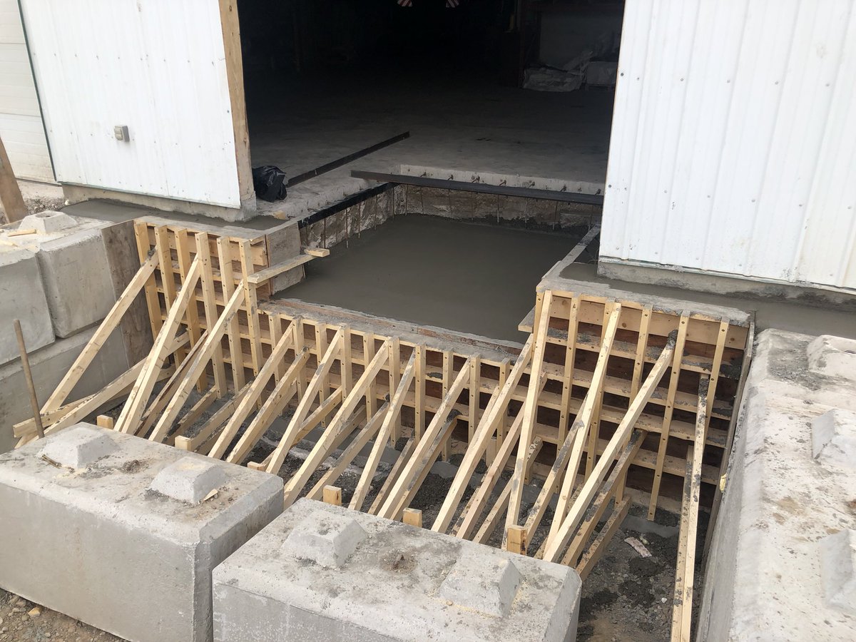 Dock wall and floor got poured today. The wall held!