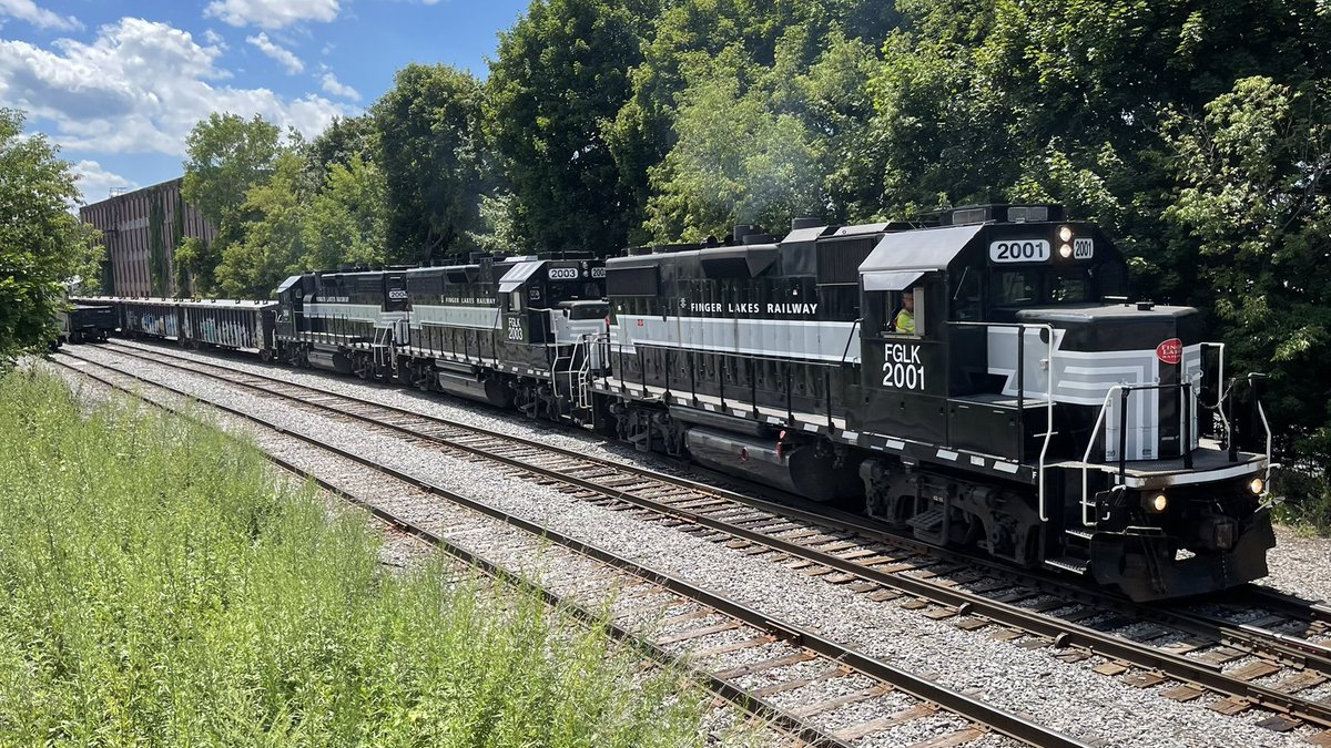 CayugaValley's tweet photo. The eastbound Finger Lakes Railway GS2 is seen dropping six empty gondolas in the Auburn Yard this afternoon. EMD GP38-2’s 2001, 2003 &amp; 2004 are today’s power. M.A.Fritz Photograph. https://t.co/xqUSpyDZeb