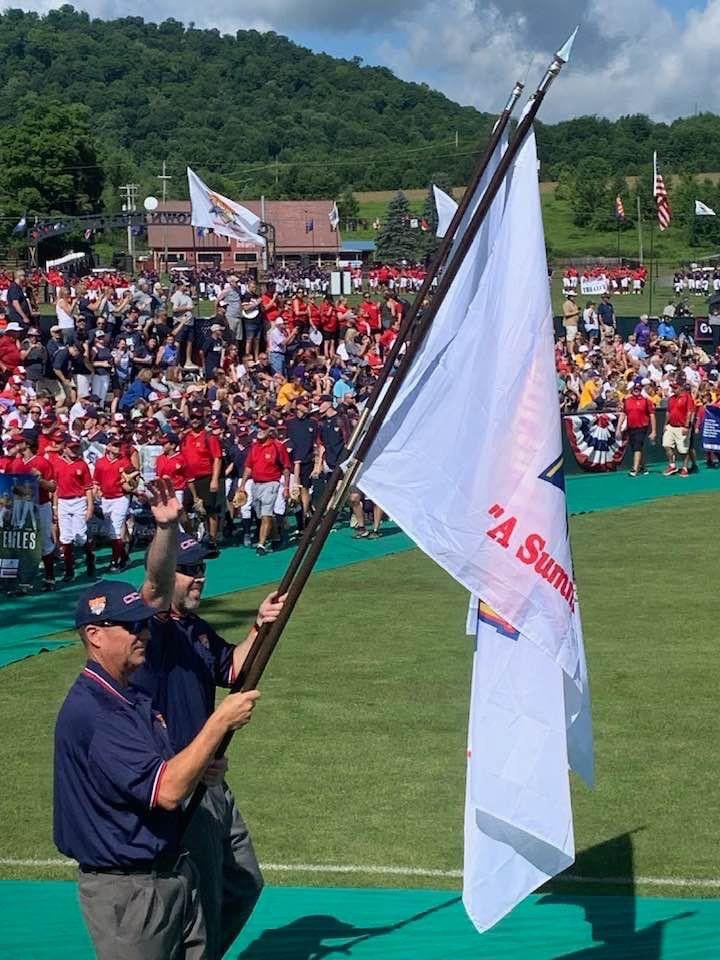 Dugout Club President, Cory Paape, was selected as one of the umpires at this week’s tournament in Cooperstown. Here he is carrying one of the flags at the Dreams Park Opening ceremonies!  Congrats Cory and good luck to our future Pirates 
Photo Credit: Amanda Georgopoulos