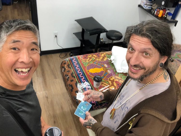 I'm so excited to meet with the artist who put the mural on the Graphic Arts Building many years ago! It's Seve Estevez at his 'Doing Tattoo' shop for the summer from Barcelona. @sevetattoo (holding some of @MiaOhki stickers!)