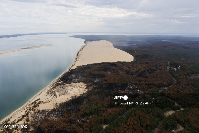 AFPphoto's tweet photo. #France - Aerial views taken by #AFP Thibaud Moritz show burnt forest area after wildfires near La Teste-de-Buch. https://t.co/n7szlJHwpC
