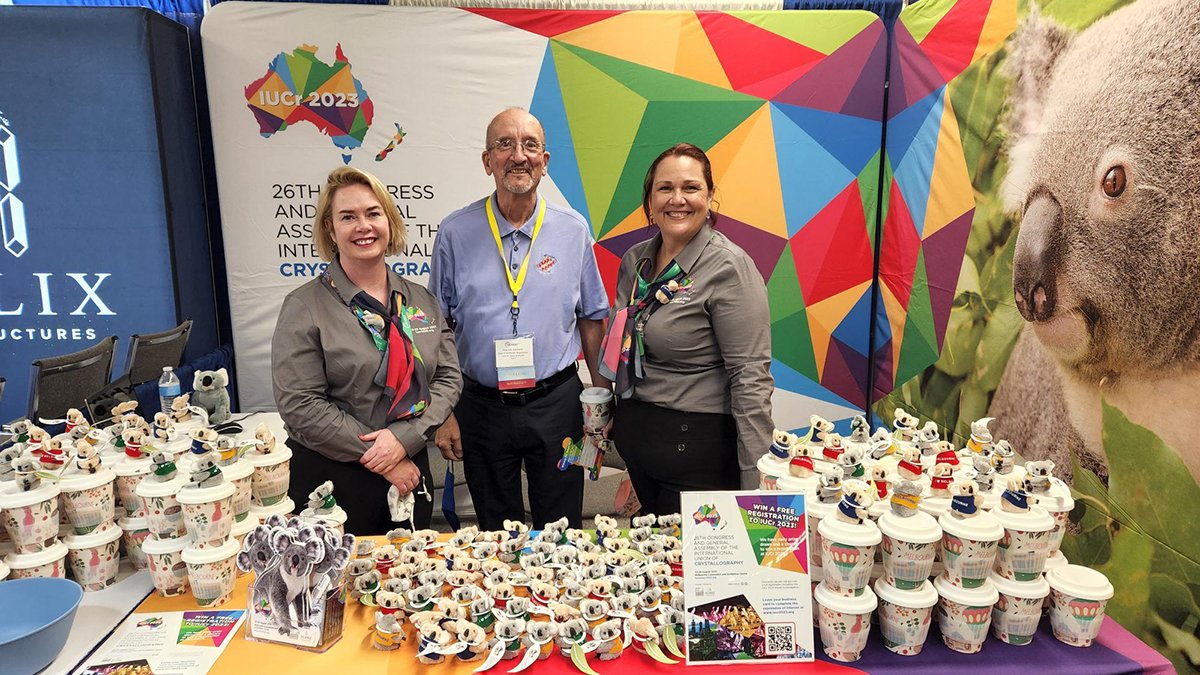 Former <a href="/IUCr/">IUCr</a> President Marv Hackert flanked by Emma Bowyer and Suellen Holland from the <a href="/IUCr2023/">IUCr2023</a> PCO. Visit their booth at #acamtg2022 for a chance to win a free registration to the next IUCr Congress 🤞🇦🇺 🐨