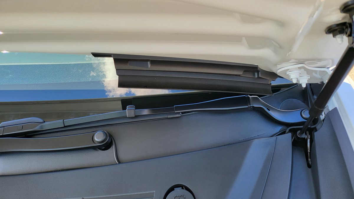 MeetMetaverse's tweet image. White on white RWD Model 3 is here! It's perfect! Also, noticed these new thingies under the frunk, to prevent water? 🤷‍♂️